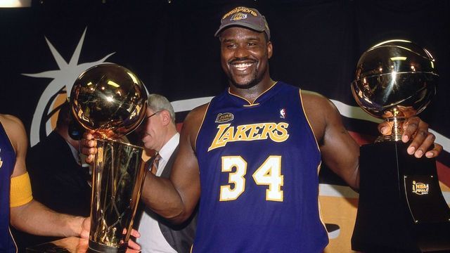 PHILADELPHIA - JUNE 15: Shaquille O'Neal #34 of the Los Angeles Lakers poses with his NBA Finals MVP and NBA Championship trophies after defeating the Philadelphia 76ers in the 2001 NBA Finals on June 15, 2001 at the First Union Center in Philadelphia, Pennsylvania. NOTE TO USER: User expressly acknowledges that, by downloading and or using this photograph, User is consenting to the terms and conditions of the Getty Images License agreement. Mandatory Copyright Notice: Copyright 2001 NBAE