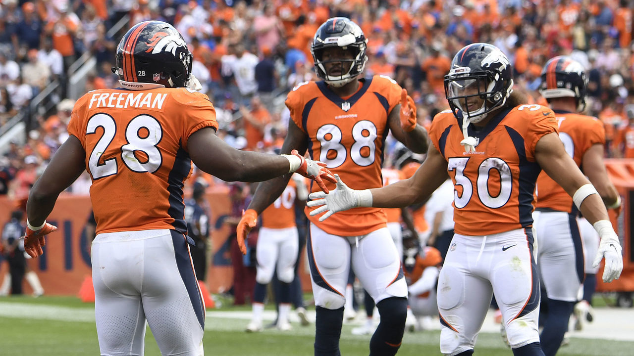 DENVER, CO - SEPTEMBER 16: Royce Freeman (28) of the Denver Broncos celebrates scoring a touchdown with Phillip Lindsay (30) during the third quarter against the Oakland Raiders. The Denver Broncos hosted the Oakland Raiders at Broncos Stadium at Mile High in Denver, Colorado on Sunday, September 16, 2018.