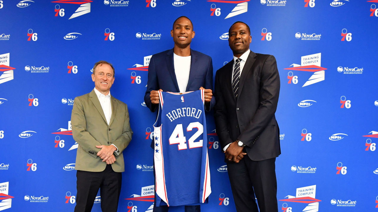 CAMDEN, NJ - JULY 12: Al Horford #42 of the Philadelphia 76ers, Josh Harris, and Elton Brand pose for a photo at a press conference on July 12, 2019 at the Philadelphia 76ers Training Complex in Camden, New Jersey. NOTE TO USER: User expressly acknowledges and agrees that, by downloading and/or using this photograph, user is consenting to the terms and conditions of the Getty Images License Agreement. Mandatory Copyright Notice: Copyright 2019 NBAE