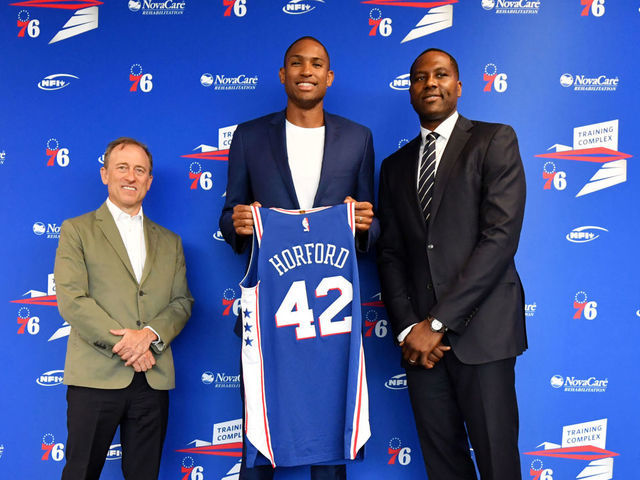 CAMDEN, NJ - JULY 12: Al Horford #42 of the Philadelphia 76ers, Josh Harris, and Elton Brand pose for a photo at a press conference on July 12, 2019 at the Philadelphia 76ers Training Complex in Camden, New Jersey. NOTE TO USER: User expressly acknowledges and agrees that, by downloading and/or using this photograph, user is consenting to the terms and conditions of the Getty Images License Agreement. Mandatory Copyright Notice: Copyright 2019 NBAE