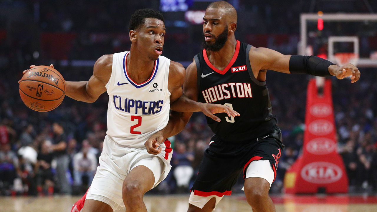 LOS ANGELES, CALIFORNIA - APRIL 03: Shai Gilgeous-Alexander #2 of the Los Angeles Clippers drives against Chris Paul #3 of the Houston Rockets during the first half at Staples Center on April 03, 2019 in Los Angeles, California.