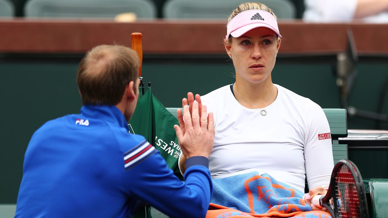 INDIAN WELLS, CALIFORNIA - MARCH 11: Angelique Kerber of Germany speaks to her coach Rainer Schuettler during a changeover break in her women's singles third round match against Natalia Vikhlyantseva of Russia on Day 8 of the BNP Paribas Open at the Indian Wells Tennis Garden on March 11, 2019 in Indian Wells, California.
