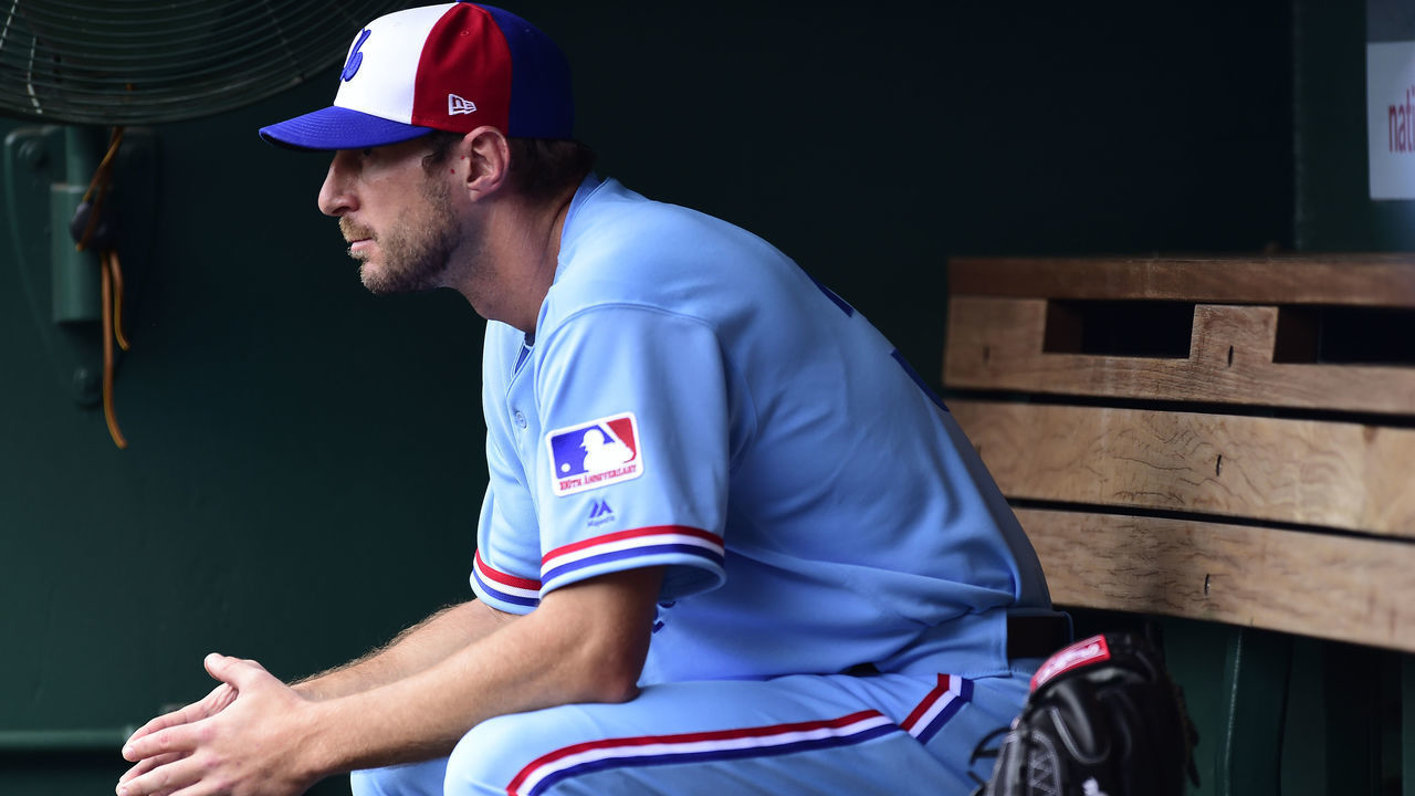 WASHINGTON, DC - JULY 06: Max Scherzer #31 of the Washington Nationals sits in the dugout before a game against the Kansas City Royals at Nationals Park on July 6, 2019 in Washington, DC. The Nationals are paying tribute to the Montreal Expos by wearing retro jerseys.