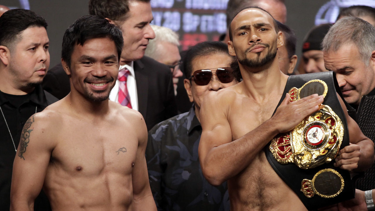 Boxers Manny Pacquiao (L) from the Philippines and Keith Thurman from the USA face off during their weigh-in on July 19, 2019, at the MGM Grand Hotel and Casino in Las Vegas, Nevada. - The fighters will meet on July 20th in a WBA super world welterweight title fight