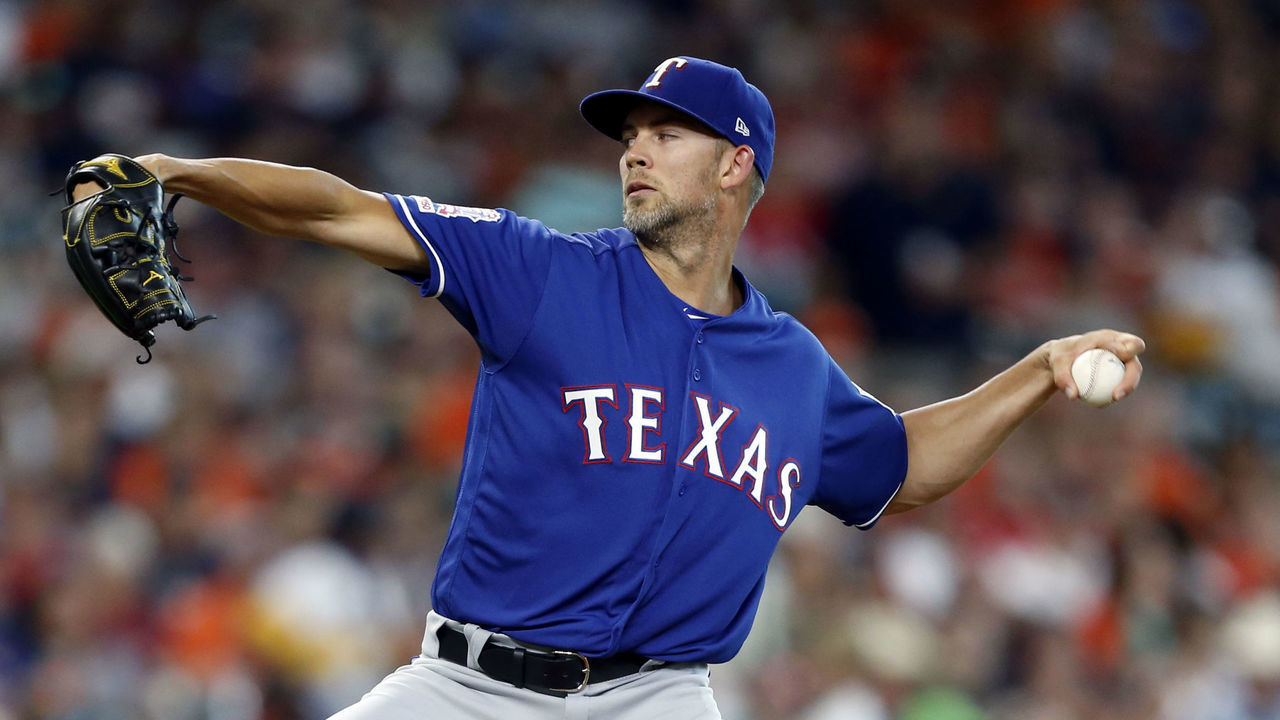 HOUSTON, TEXAS - JULY 19: Mike Minor #23 of the Texas Rangers pitches in the first inning against the Houston Astros at Minute Maid Park on July 19, 2019 in Houston, Texas.
