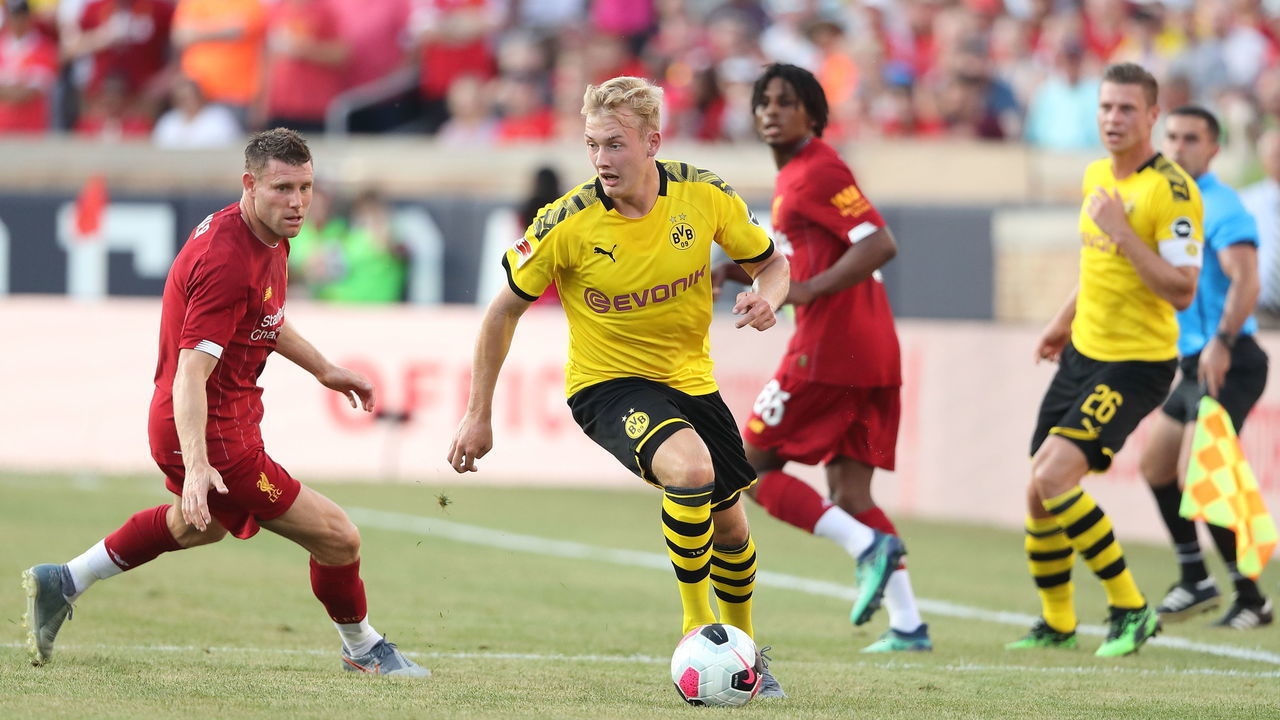SOUTH BEND, IN - JULY 19: Julian Brandt of Borussia Dortmund turns away from James Milner of Liverpool during the pre-season friendly match between Borussia Dortmund and Liverpool FC at Notre Dame Stadium on July 19, 2019 in South Bend, Indiana.