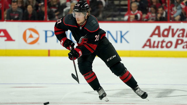 RALEIGH, NC - MAY 03: Brock McGinn #23 of the Carolina Hurricanes skates with the puck in Game Four of the Eastern Conference Second Round against the New York Islanders during the 2019 NHL Stanley Cup Playoffs on May 3, 2019 at PNC Arena in Raleigh, North Carolina.