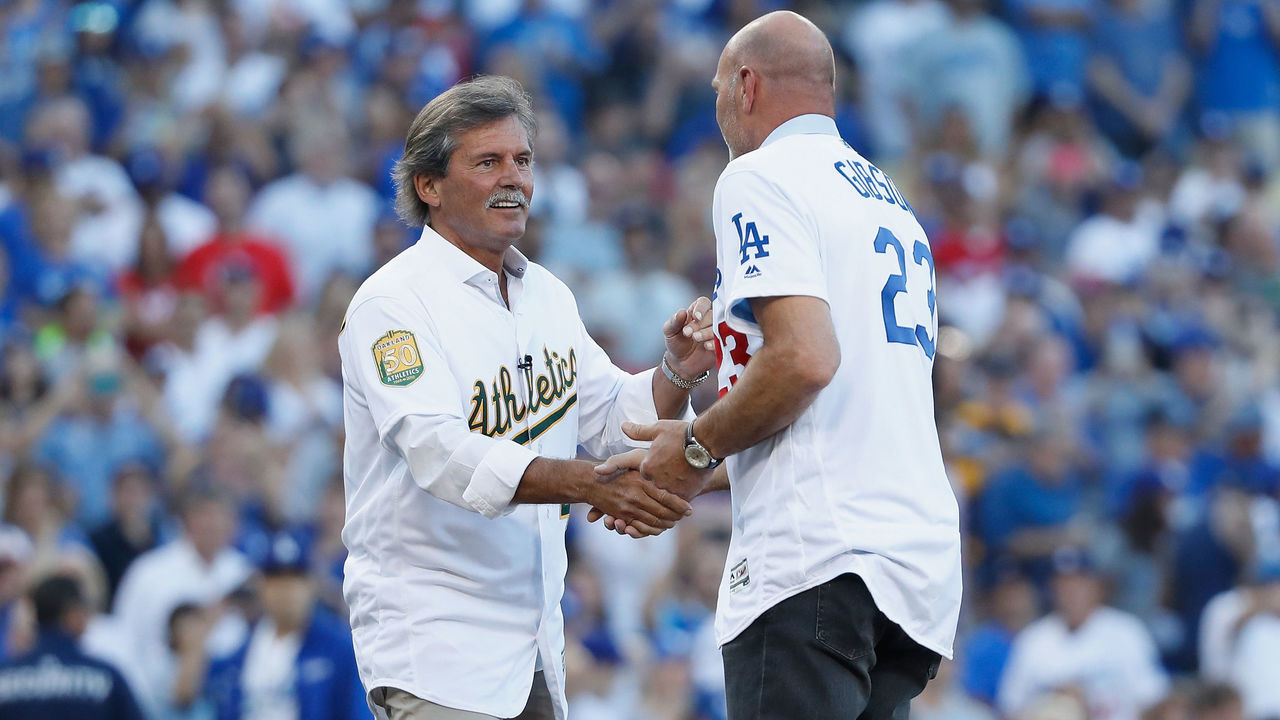 LOS ANGELES, CA - OCTOBER 27: Dennis Eckersley (L) and Kirk Gibson shake hands on the mound after Eckersley threw out the ceremonial first pitch to Gibson prior to in Game Four of the 2018 World Series between the Boston Red Sox and the Los Angeles Dodgers at Dodger Stadium on October 27, 2018 in Los Angeles, California.
