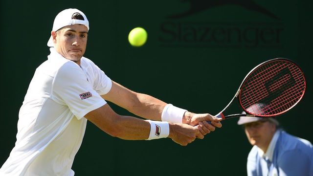 US player John Isner returns against Kazakhstan's Mikhail Kukushkin during their men's singles second round match on the fourth day of the 2019 Wimbledon Championships at The All England Lawn Tennis Club in Wimbledon, southwest London, on July 4, 2019.