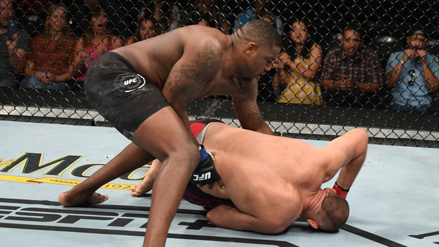 SAN ANTONIO, TEXAS - JULY 20: (L-R) Walt Harris punches Aleksei Oleinik of Russia in their heavyweight bout during the UFC Fight Night event at AT&T Center on July 20, 2019 in San Antonio, Texas.