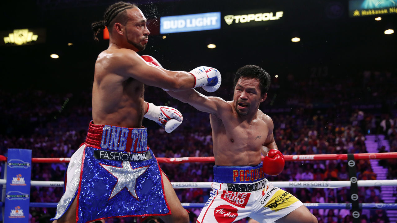 LAS VEGAS, NEVADA - JULY 20: Manny Pacquiao (R) connects with a punch on Keith Thurman during their WBA welterweight title fight at MGM Grand Garden Arena on July 20, 2019 in Las Vegas, Nevada.