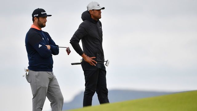 US golfer Tony Finau (R) and Spain's Jon Rahm stand on the 5th green during the final round of the British Open golf Championships at Royal Portrush golf club in Northern Ireland on July 21, 2019.