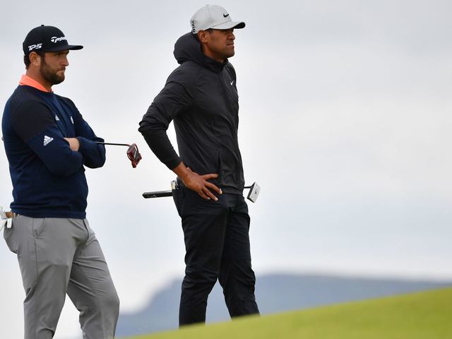 US golfer Tony Finau (R) and Spain's Jon Rahm stand on the 5th green during the final round of the British Open golf Championships at Royal Portrush golf club in Northern Ireland on July 21, 2019.