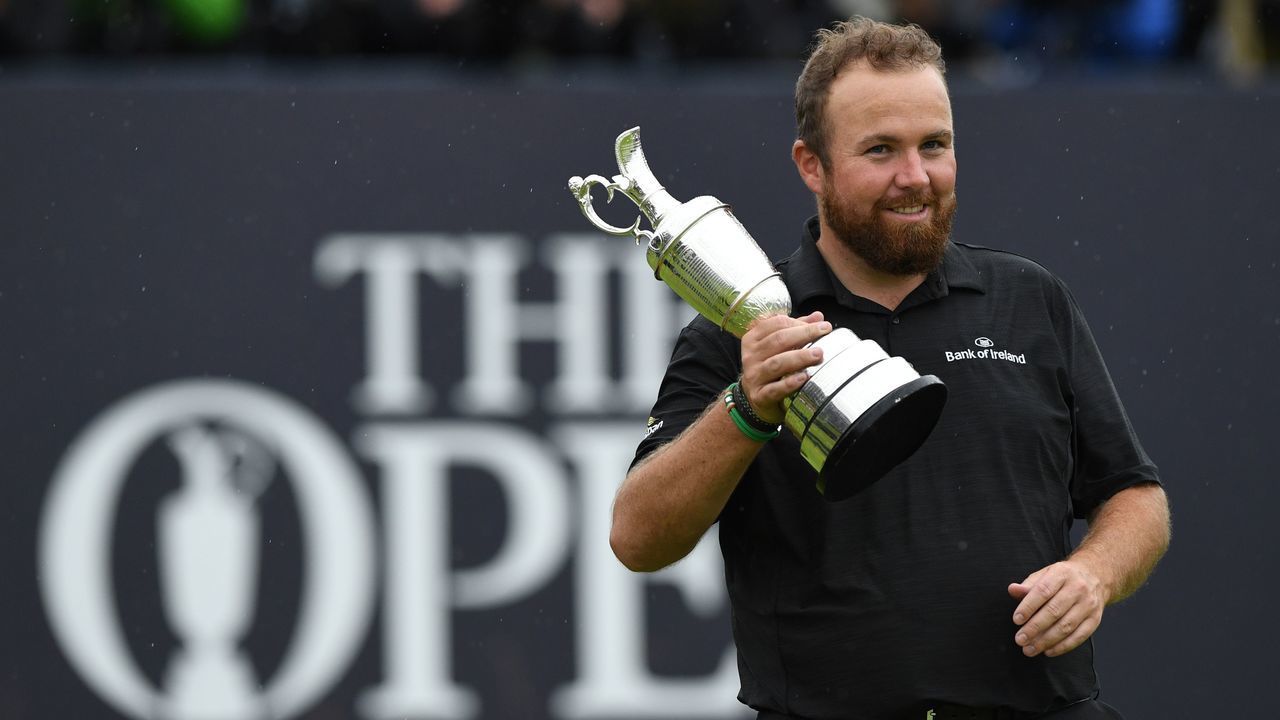 Ireland's Shane Lowry poses with the Claret Jug, the trophy for the Champion golfer of the year after winning the British Open golf Championships at Royal Portrush golf club in Northern Ireland on July 21, 2019.