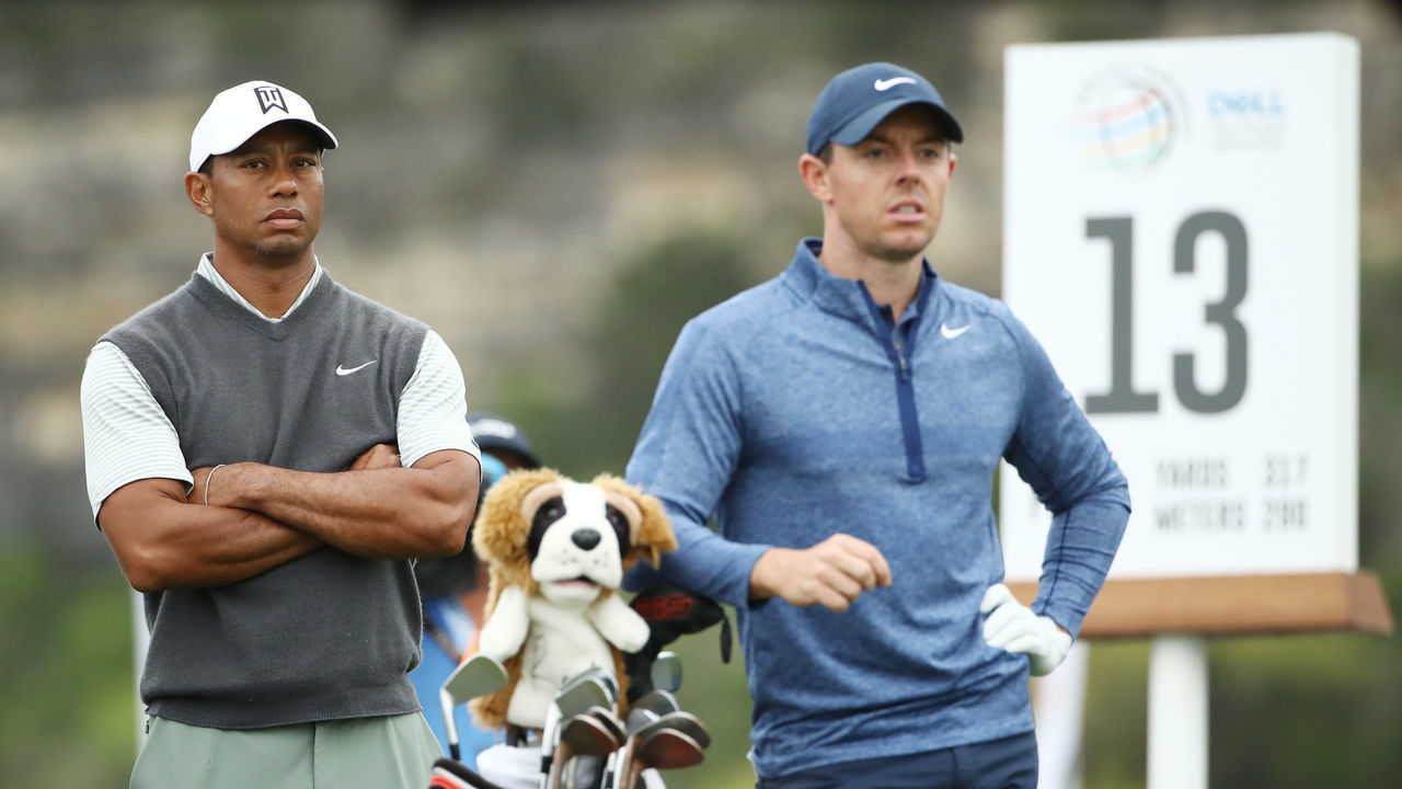 AUSTIN, TEXAS - MARCH 30: Tiger Woods of the United States and Rory McIlroy of Northern Ireland stand on the 13th tee during the fourth round of the World Golf Championships-Dell Technologies Match Play at Austin Country Club on March 30, 2019 in Austin, Texas.