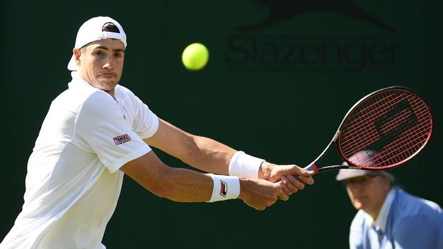 US player John Isner returns against Kazakhstan's Mikhail Kukushkin during their men's singles second round match on the fourth day of the 2019 Wimbledon Championships at The All England Lawn Tennis Club in Wimbledon, southwest London, on July 4, 2019.