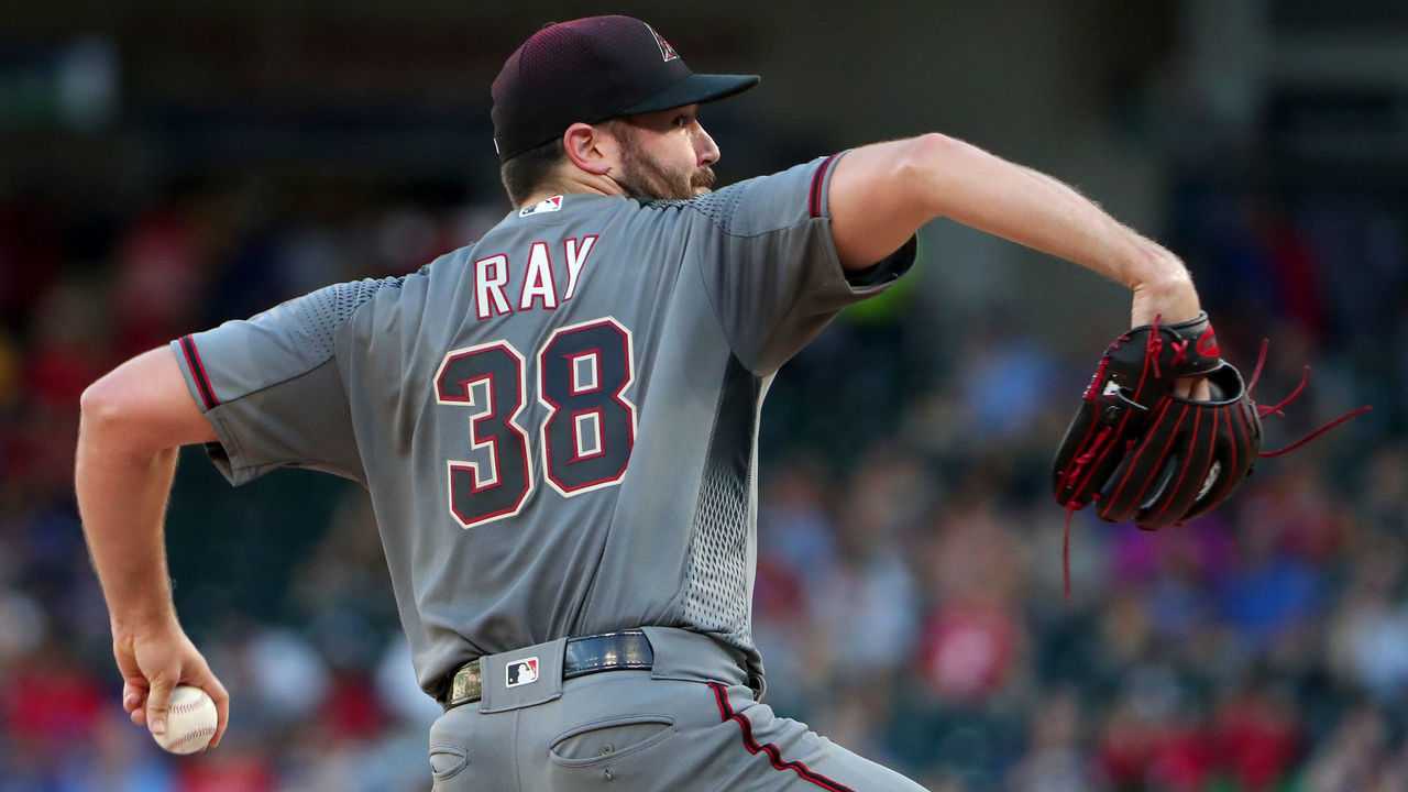 ARLINGTON, TEXAS - JULY 17: Robbie Ray #38 of the Arizona Diamondbacks pitches against the Texas Rangers in the bottom of the first inning at Globe Life Park in Arlington on July 17, 2019 in Arlington, Texas.