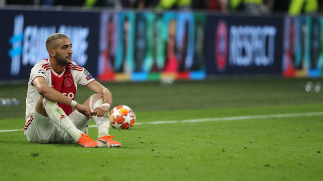 AMSTERDAM, NETHERLANDS - MAY 08: A dejected Hakim Ziyech of Ajax Amsterdam reacts at full time during the UEFA Champions League Semi Final second leg match between Ajax and Tottenham Hotspur at the Johan Cruyff Arena on May 8, 2019 in Amsterdam, Netherlands.