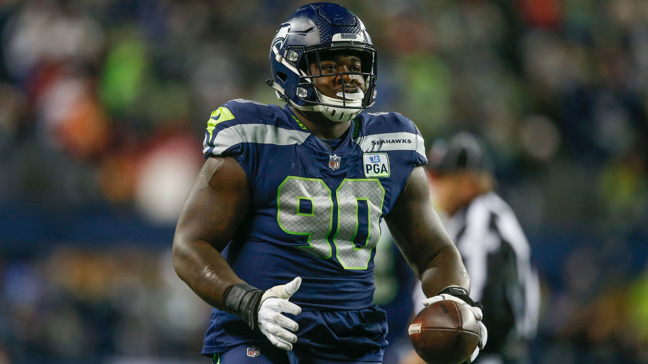 SEATTLE, WA - DECEMBER 23: Defensive tackle Jarran Reed #90 of the Seattle Seahawks reacts after recovering a fumble against the Kansas City Chiefs at CenturyLink Field on December 23, 2018 in Seattle, Washington.