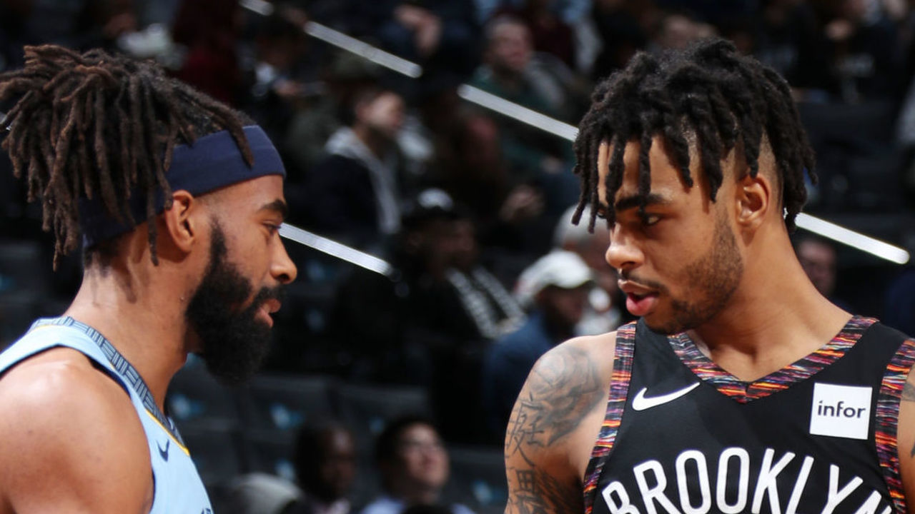 BROOKLYN, NY - NOVEMBER 30: Mike Conley #11 of the Memphis Grizzlies and D'Angelo Russell #1 of the Brooklyn Nets shake hands during the game on November 30, 2018 at the Barclays Center in Brooklyn, New York. NOTE TO USER: User expressly acknowledges and agrees that, by downloading and/or using this photograph, user is consenting to the terms and conditions of the Getty Images License Agreement. Mandatory Copyright Notice: Copyright 2018 NBAE