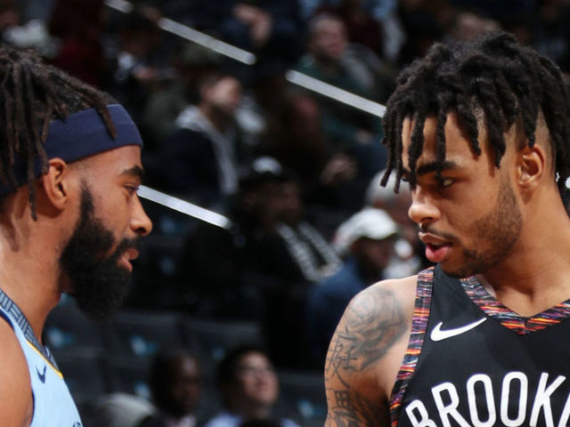 BROOKLYN, NY - NOVEMBER 30: Mike Conley #11 of the Memphis Grizzlies and D'Angelo Russell #1 of the Brooklyn Nets shake hands during the game on November 30, 2018 at the Barclays Center in Brooklyn, New York. NOTE TO USER: User expressly acknowledges and agrees that, by downloading and/or using this photograph, user is consenting to the terms and conditions of the Getty Images License Agreement. Mandatory Copyright Notice: Copyright 2018 NBAE
