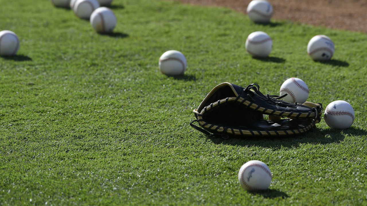 ANAHEIM, CA - JULY 17: A glove sits on the infield surrounded by baseballs during batting practice between the Los Angeles Angels of Anaheim and Houston Astros at Angel Stadium of Anaheim on July 17, 2019 in Anaheim, California. Astros won 12-2.