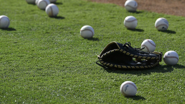 ANAHEIM, CA - JULY 17: A glove sits on the infield surrounded by baseballs during batting practice between the Los Angeles Angels of Anaheim and Houston Astros at Angel Stadium of Anaheim on July 17, 2019 in Anaheim, California. Astros won 12-2.