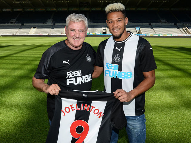 NEWCASTLE UPON TYNE, ENGLAND - JULY 22: Joelinton (R) poses for a photograph with Newcastle United Head Coach Steve Bruce (L) during a photoshoot at St.James' Park on July 22, 2019 in Newcastle upon Tyne, England.