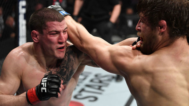 OTTAWA, ON - MAY 04: (L-R) Marc-Andre Barriault of Canada and Andrew Sanchez exchange punches in their middleweight bout during the UFC Fight Night event at Canadian Tire Centre on May 4, 2019 in Ottawa, Ontario, Canada.
