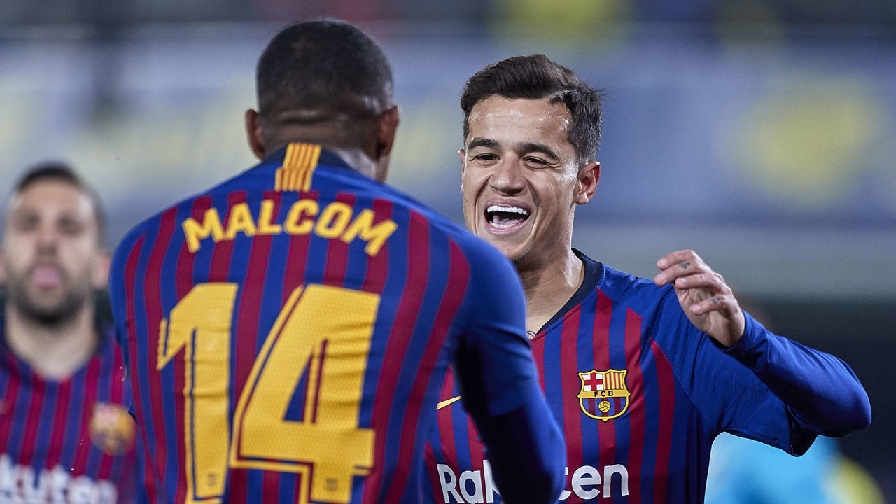 VILLAREAL, SPAIN - APRIL 02: Philippe Coutinho of FC Barcelona celebrates with Malcom of FC Barcelona after scoring his team's first goal during the La Liga match between Villarreal CF and FC Barcelona at Estadio de la Ceramica on April 02, 2019 in Villareal, Spain.