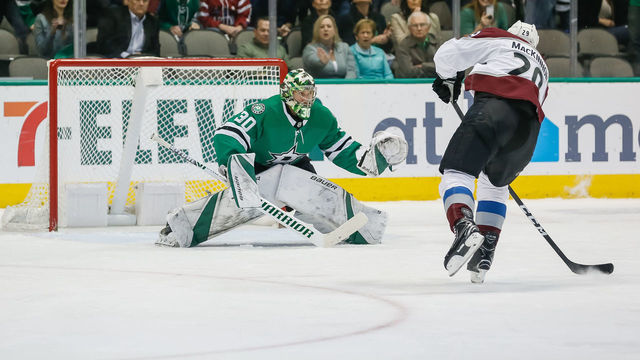 DALLAS, TX - MARCH 21: Colorado Avalanche center Nathan MacKinnon (29) shoots the puck on a breakaway against Dallas Stars goaltender Ben Bishop (30) during the game between the Dallas Stars and the Colorado Avalanche on March 21, 2019 at the American Airlines Center in Dallas, Texas.