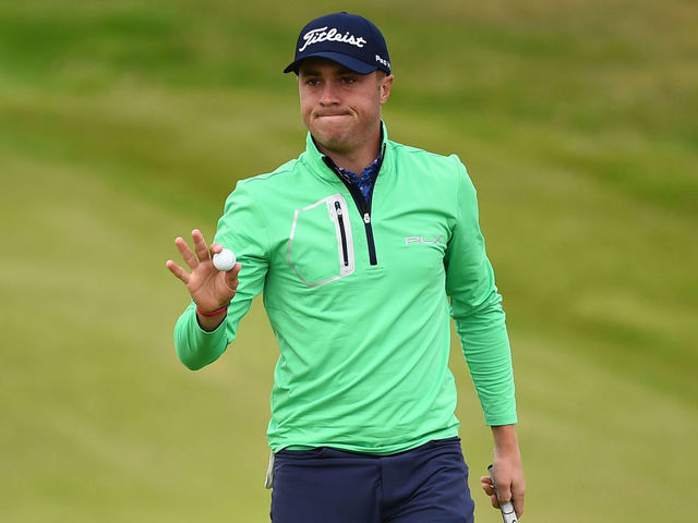 US golfer Justin Thomas reacts after putting in on the 2nd hole during the second round of the British Open golf Championships at Royal Portrush golf club in Northern Ireland on July 19, 2019.