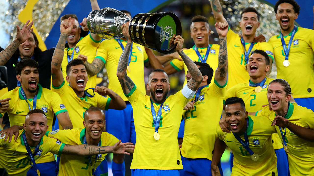 RIO DE JANEIRO, BRAZIL - JULY 07: Dani Alves of Brazil lifts the trophy following the Copa America Brazil 2019 Final match between Brazil and Peru at Maracana Stadium on July 07, 2019 in Rio de Janeiro, Brazil.