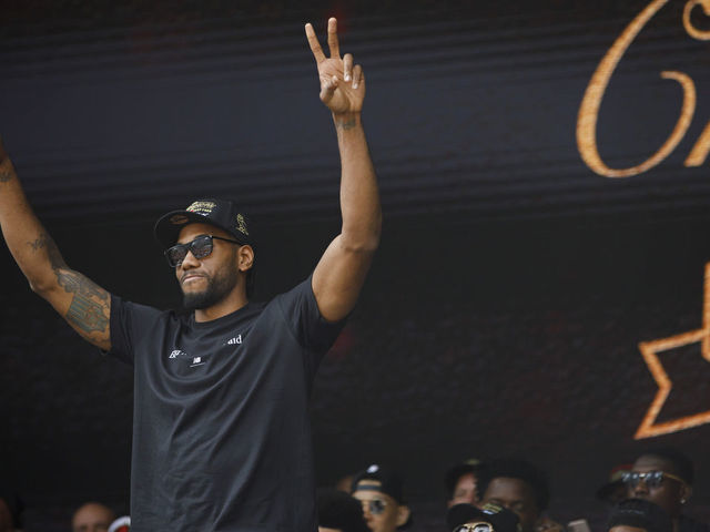 TORONTO, ON - JUNE 17: Kawhi Leonard #2 of the Toronto Raptors waves to the crowd during the Toronto Raptors Championship Victory Parade on June 17, 2019 in Toronto, Ontario. NOTE TO USER: User expressly acknowledges and agrees that, by downloading and/or using this photograph, user is consenting to the terms and conditions of Getty Images License Agreement. Mandatory Copyright Notice: Copyright 2019 NBAE