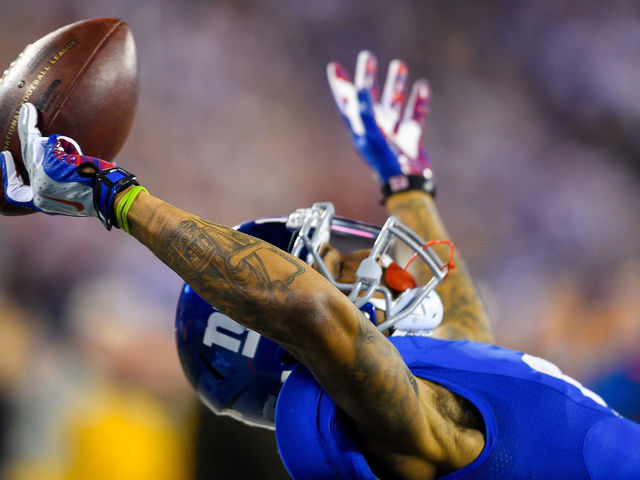 November 23, 2014: New York Giants wide receiver Odell Beckham (13) makes a 43 yard touchdown catch during the second quarter during a NFL game between the Dallas Cowboys and New York Giants at MetLife Stadium in East Rutherford, NJ The Cowboys defeated the Giants 31-28.