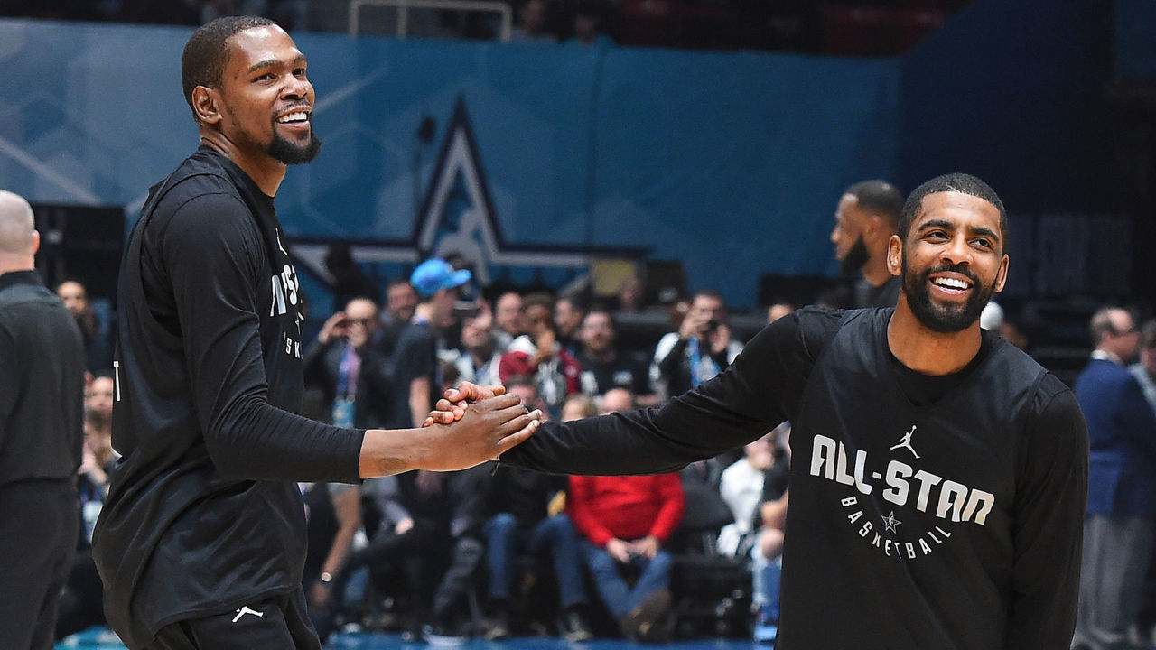 CHARLOTTE, NC - FEBRUARY 16: Kevin Durant #35 and Kyrie Irving #11 of Team LeBron shake hands during the 2019 NBA All-Star Practice and Media Availability on February 16, 2019 at Bojangles Coliseum in Charlotte, North Carolina. Mandatory Copyright Notice: Copyright 2019 NBAE