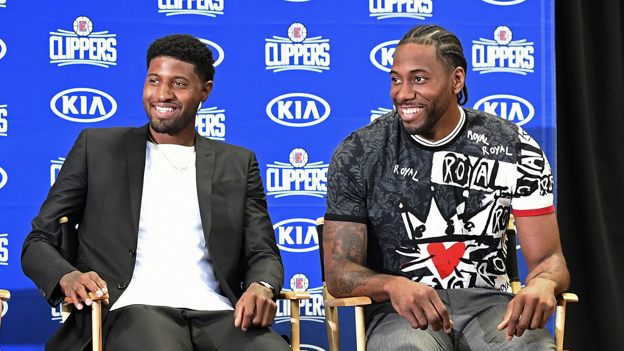 LOS ANGELES, CA - JULY 24: Kawhi Leonard (R) and Paul George smile during their Los Angeles Clippers introductory news conference at Green Meadows Recreation Center on July 24, 2019 in Los Angeles, California. at Green Meadows Recreation Center on July 24, 2019 in Los Angeles, California.