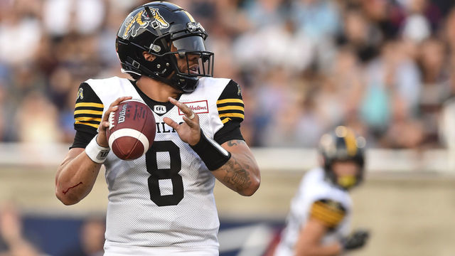 MONTREAL, QC - JULY 04: Jeremiah Masoli #8 of the Hamilton Tiger-Cats looks to play the ball against the Montreal Alouettes during the CFL game at Percival Molson Stadium on July 4, 2019 in Montreal, Quebec, Canada. The Montreal Alouettes defeated the Hamilton Tiger-Cats 36-29.