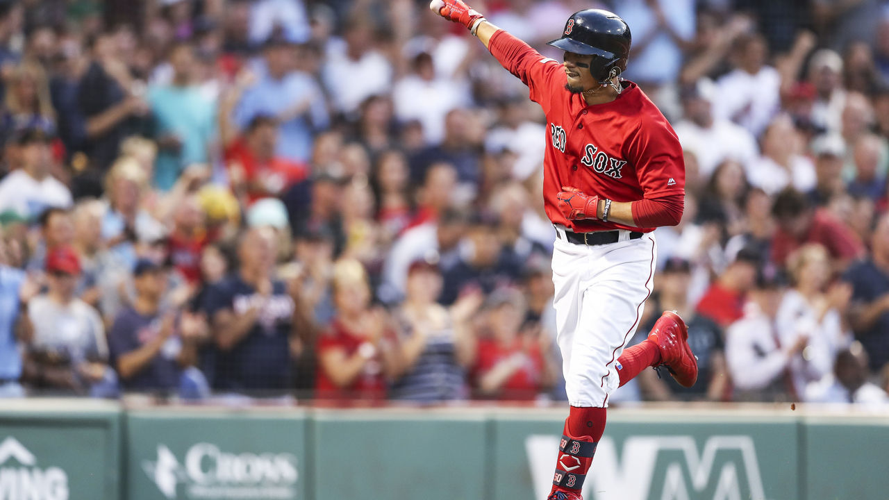BOSTON, MA - JULY 26: Mookie Betts #50 of the Boston Red Sox reacts as he returns to the dugout after hitting a solo home run in the third inning of a game against the New York Yankees at Fenway Park on July 26, 2019 in Boston, Massachusetts.