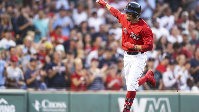 BOSTON, MA - JULY 26: Mookie Betts #50 of the Boston Red Sox reacts as he returns to the dugout after hitting a solo home run in the third inning of a game against the New York Yankees at Fenway Park on July 26, 2019 in Boston, Massachusetts.