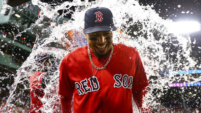BOSTON, MA - JULY 26: Mookie Betts #50 of the Boston Red Sox is showered in Gatorade after the Boston Red Sox defeated the New York Yankees 10-5 at Fenway Park on July 26, 2019 in Boston, Massachusetts.