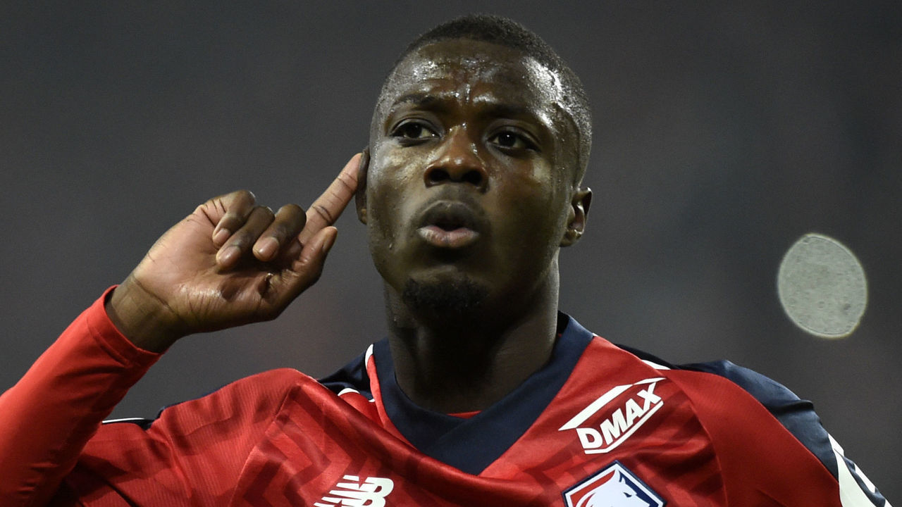 Lille's Ivorian forward Nicolas Pepe celebrates after scoring a goal during the French L1 football match between Lille (LOSC) and Olympique Lyonnais (OL) on December 1, 2018 at the Pierre Mauroy Stadium in Villenueve d'Ascq.