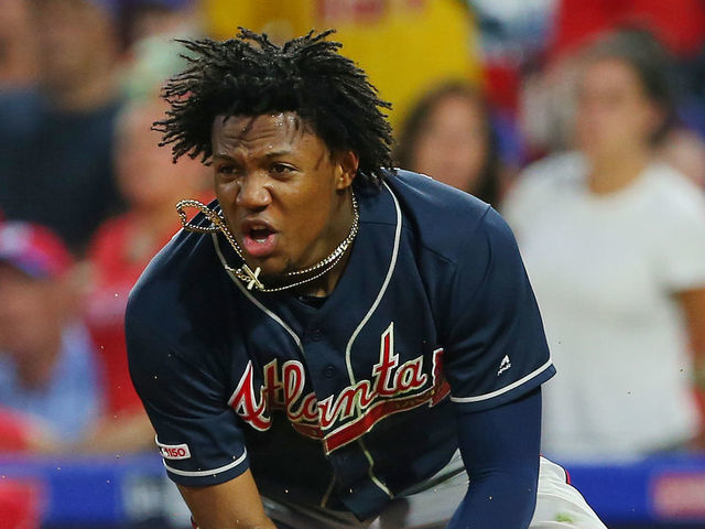 PHILADELPHIA, PA - JULY 26: Ronald Acuna Jr. #13 of the Atlanta Braves reacts after scoring during a game against the Philadelphia Phillies at Citizens Bank Park on July 26, 2019 in Philadelphia, Pennsylvania.