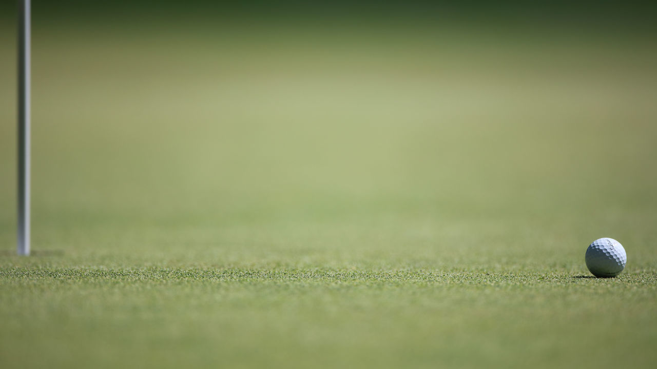 CROMWELL, CONNECTICUT- June 24: A generic image of a golf ball near the pin during the Travelers Championship Tournament at the TPC River Highlands Golf Course on June 24th, 2017 in Cromwell, Connecticut.