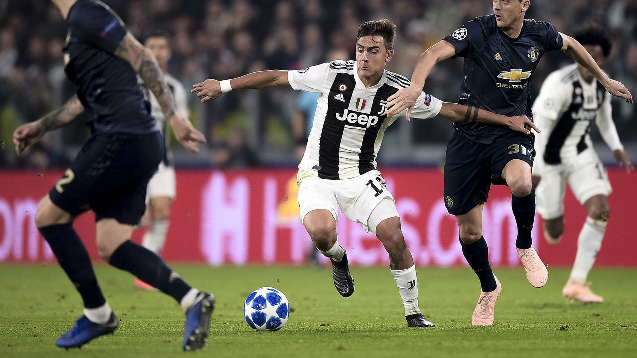 ALLIANZ STADIUM, TURIN, ITALY - 2018/11/07: Paulo Dybala (C) of Juventus FC competes for the ball with Nemanja Matic of Manchester United FC during the Group H football match of the UEFA Champions League between Juventus FC and Manchester United FC. Manchester United FC won 2-1 over Juventus FC.
