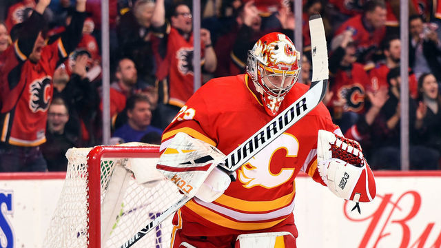 CALGARY, AB - MARCH 15: Calgary Flames Goalie David Rittich (33) celebrates a goal by his team during the first period of an NHL game where the Calgary Flames hosted the New York Rangers on March 15, 2019, at the Scotiabank Saddledome in Calgary, AB.
