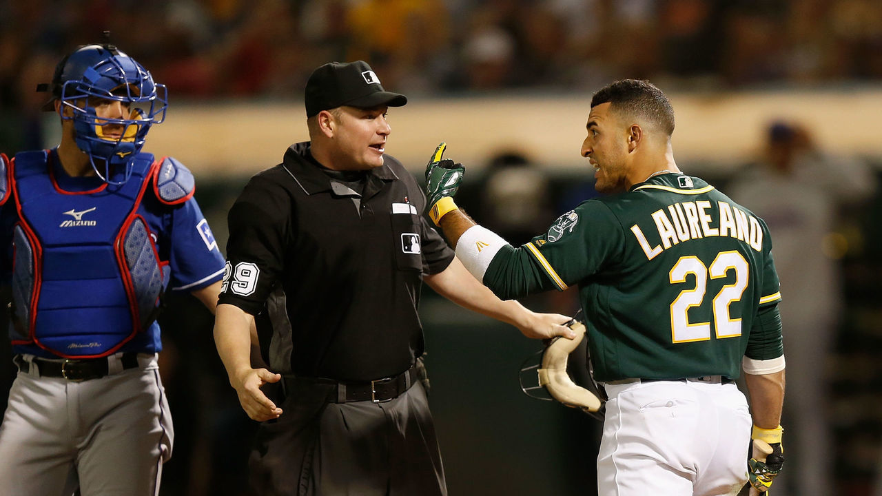 OAKLAND, CALIFORNIA - JULY 27: Ramon Laureano #22 of the Oakland Athletics reacts after being hit by a pitch in the bottom of the eighth inning against the Texas Rangers at Ring Central Coliseum on July 27, 2019 in Oakland, California.