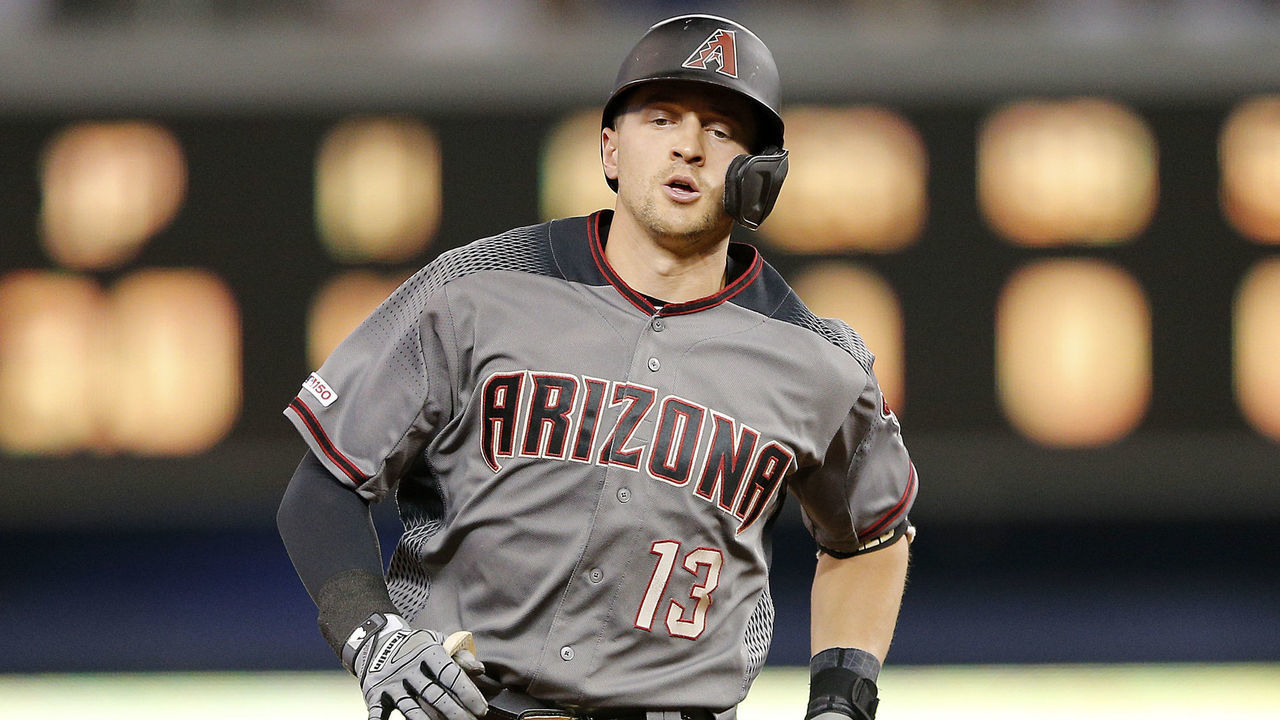 MIAMI, FLORIDA - JULY 27: Nick Ahmed #13 of the Arizona Diamondbacks rounds the bases after hitting a grand slam in the fourth inning against the Miami Marlins at Marlins Park on July 27, 2019 in Miami, Florida.