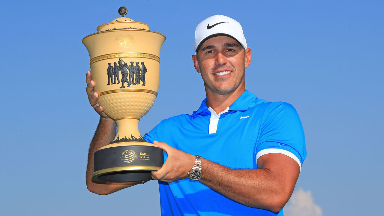 MEMPHIS, TENNESSEE - JULY 28: Brooks Koepka poses with the trophy after winning the World Golf Championship-FedEx St Jude Invitational at TPC Southwind on July 28, 2019 in Memphis, Tennessee.