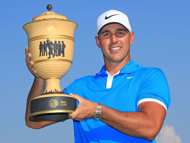 MEMPHIS, TENNESSEE - JULY 28: Brooks Koepka poses with the trophy after winning the World Golf Championship-FedEx St Jude Invitational at TPC Southwind on July 28, 2019 in Memphis, Tennessee.